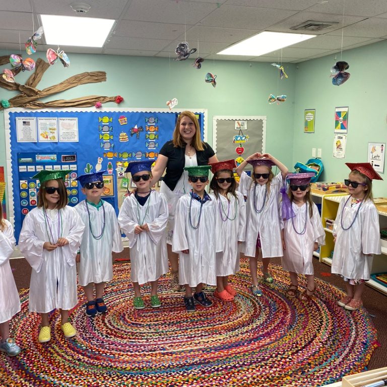 Children in caps and gowns for graduation