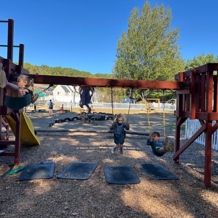 Children swinging on the playground